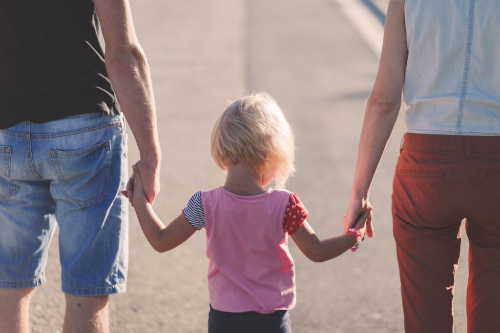 a visualization of a couple holding hands with a child tackling the topic does a new partner affect child custody